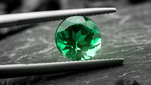 A cut and polished emerald