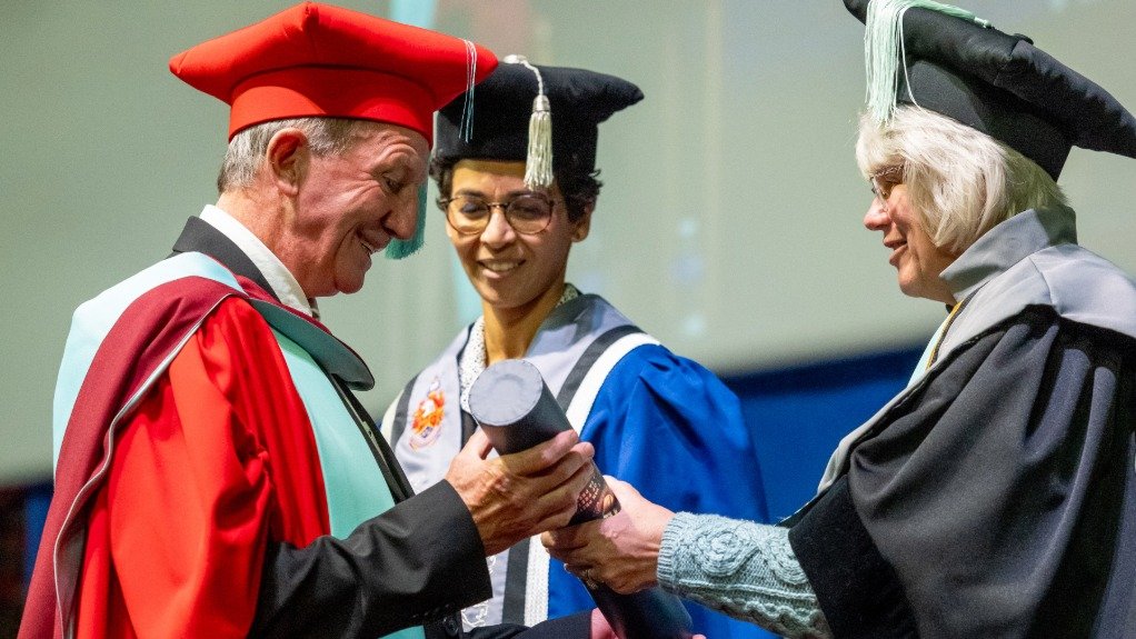 Prof Justin Jonas (left) receiving his honorary doctorate