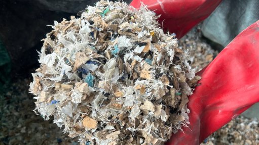 a handful of refuse waste and high-calorific materials