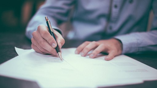 Person signing a contract
