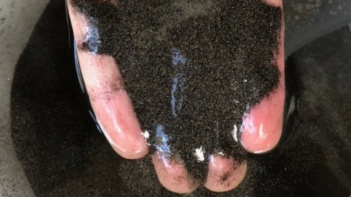 Titanium mineral sands in hand