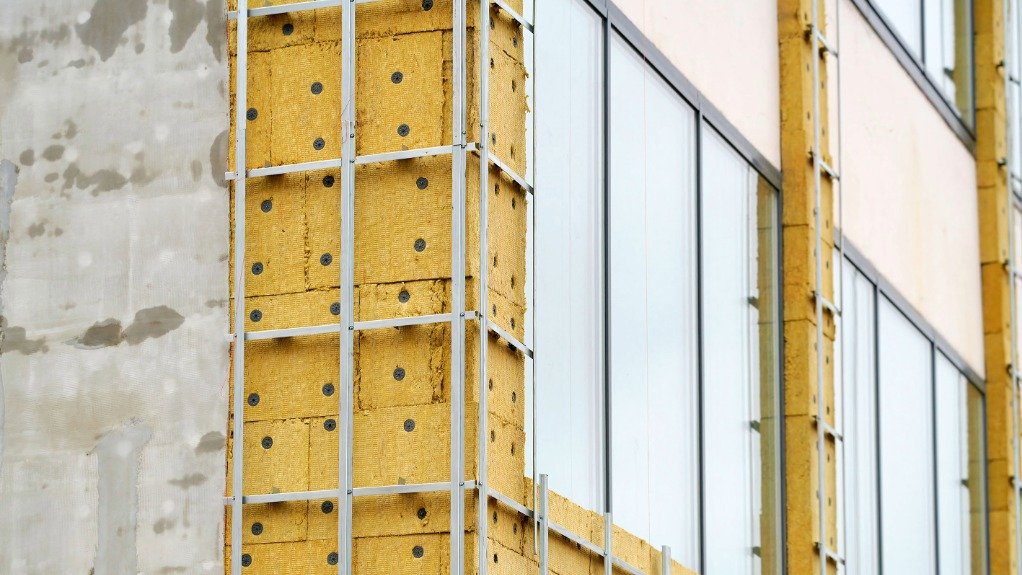 An image of exterior insulation being fitted to a building