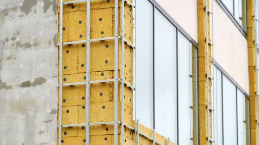 An image of exterior insulation being fitted to a building