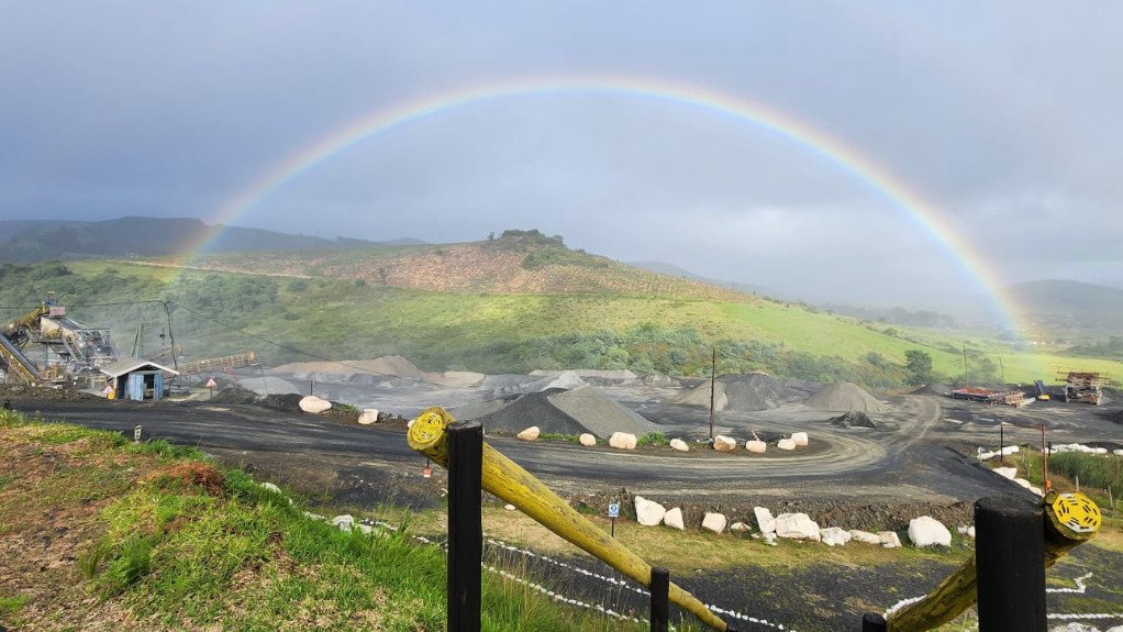 A rainbow over a quarry after a storm