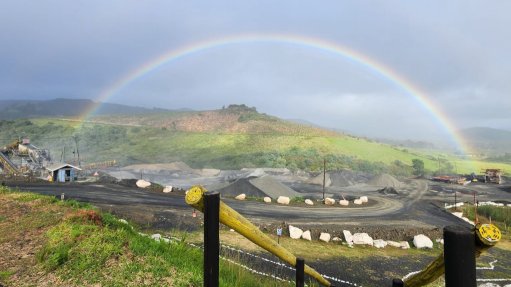 A rainbow over a quarry after a storm