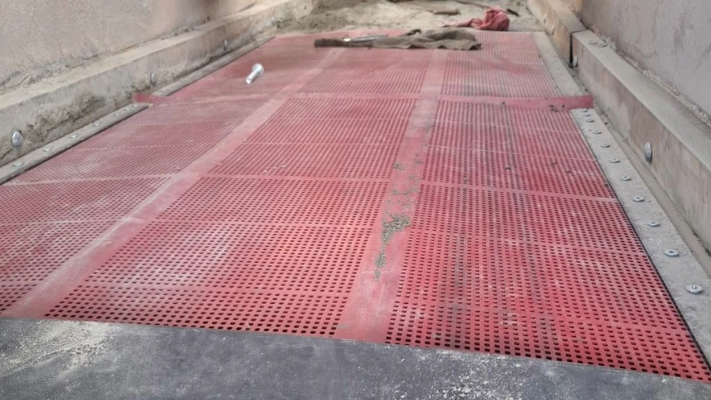 a red side-tension rubber mat used in screening on quarries