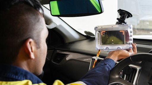 Image of a driver using collision avoidance technology inside a vehicle