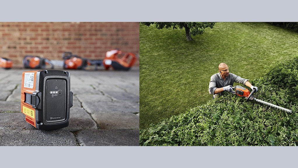 Image of a Battery-powered outdoor tool being used to cut a hedge