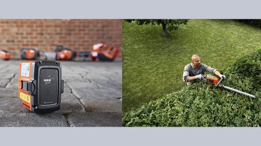Image of a Battery-powered outdoor tool being used to cut a hedge