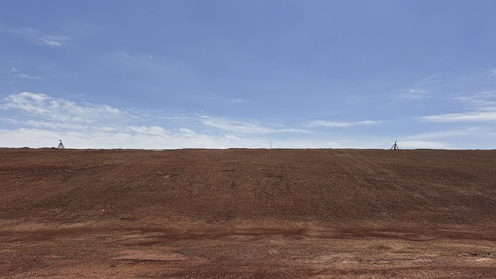 A topsoil-clad Tailings Storage Facility (TSF) utilising dust suppression and irrigation water cannons helps minimise airborne dust emissions while supporting vegetation establishment and improved environmental management.