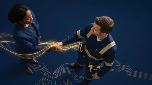 a man and woman stood shaking hands 