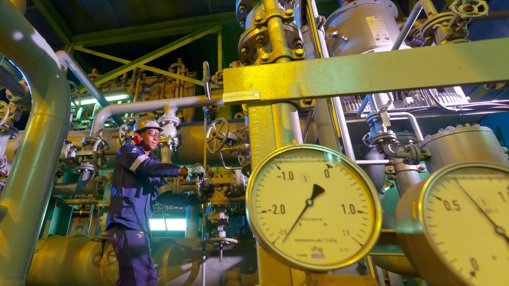 The above image depicts a technician working in a hydrogen plant 