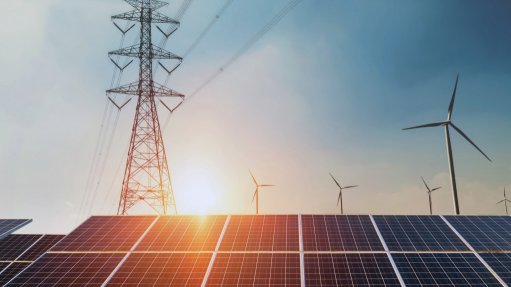 A generic image of solar panels, electricity pylons and wind turbines