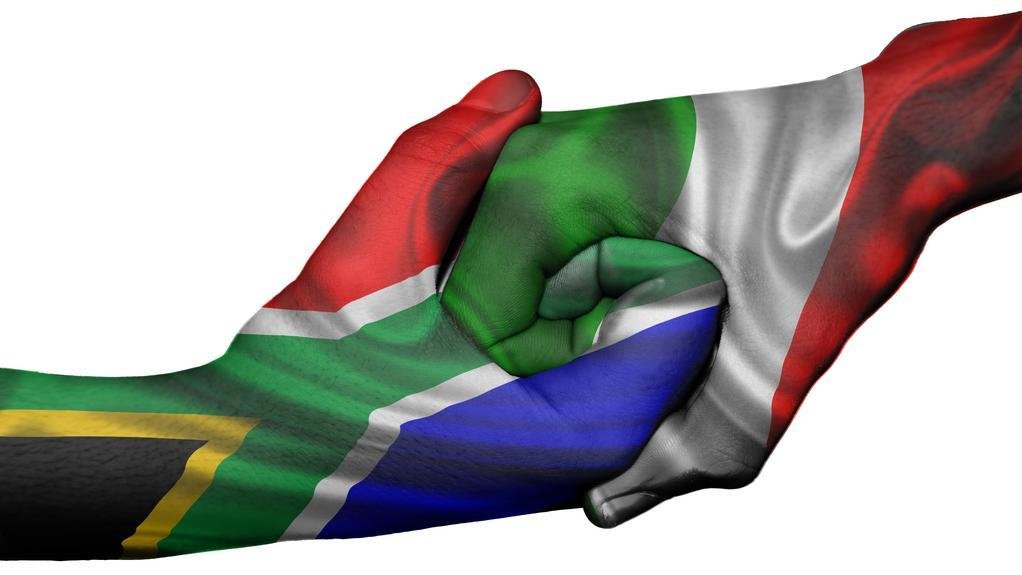 SA flag on hands shaking