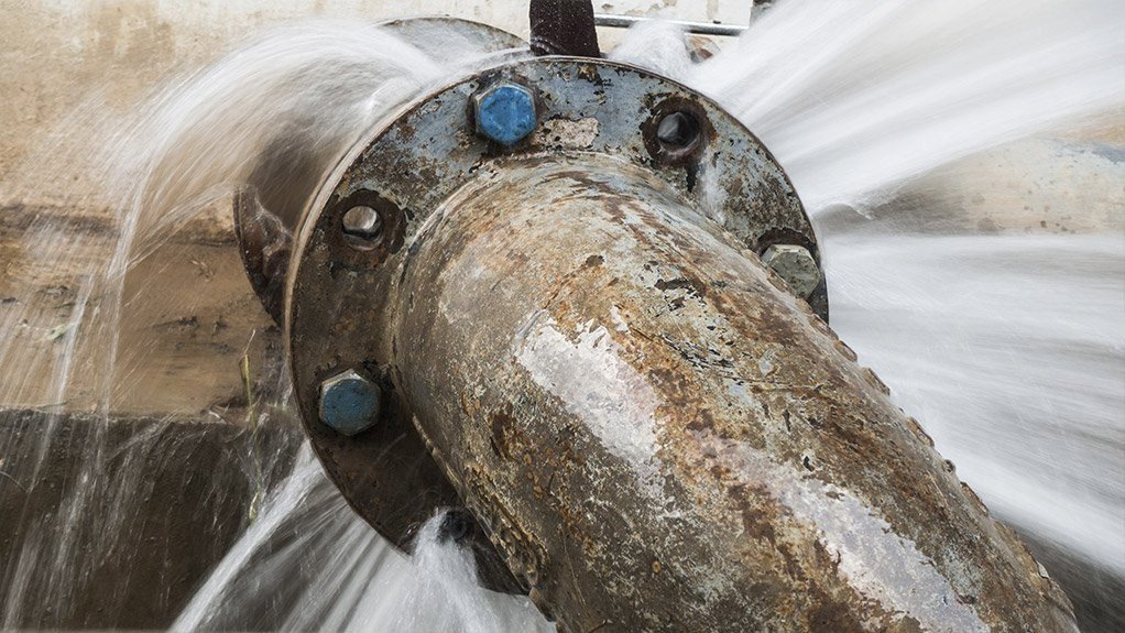 A burst bulk water pipe gushing water