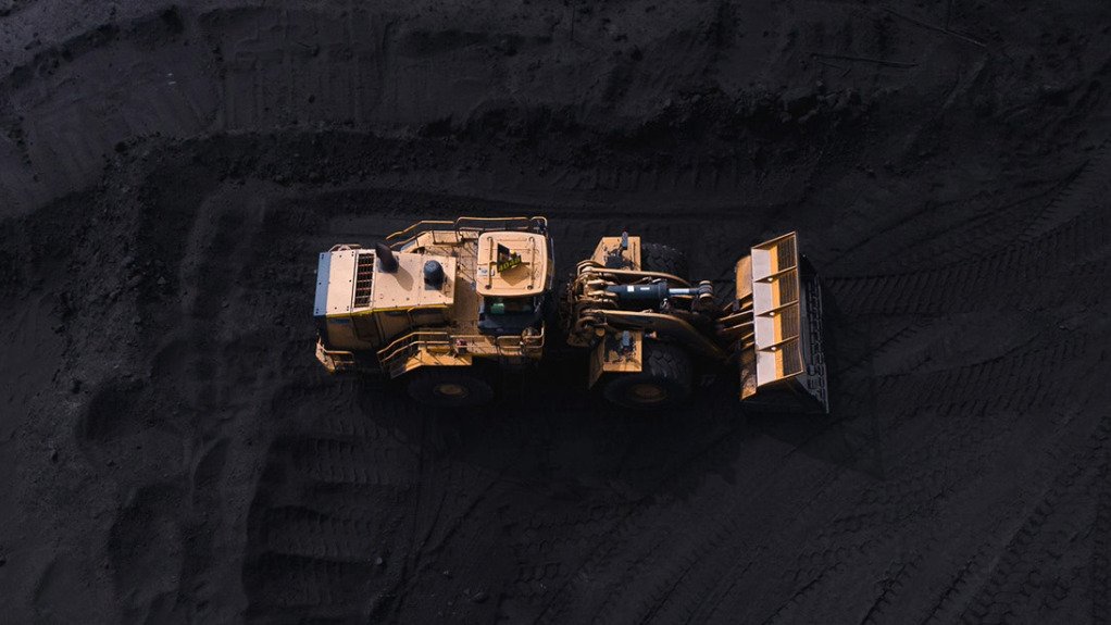 Mine truck on coal heap