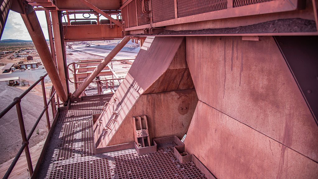 A Weba Chute Systems bifurcated transfer chute controls material flow and optimises distribution at a Northern Cape iron ore mine