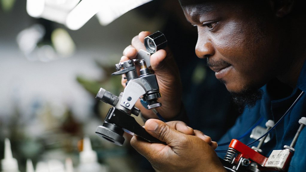 An employee analyses large rough diamonds using microscopes and advanced technology at the GSS facility in Gaborone, Botswana