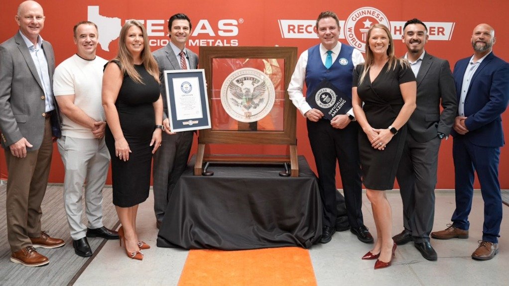 Texas Precious Metals and Sunshine Minting executives alongside 'world's heaviest silver coin' 