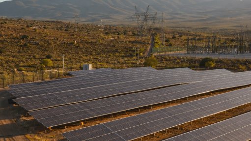 Image of solar panels with mountain in background
