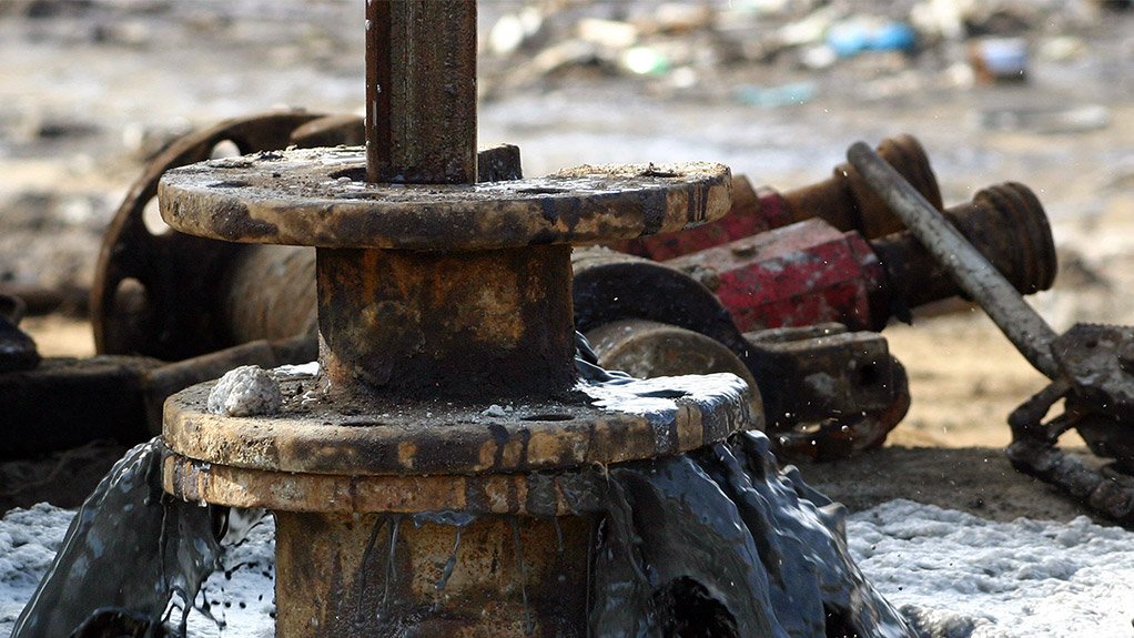 Crude oil pours from well