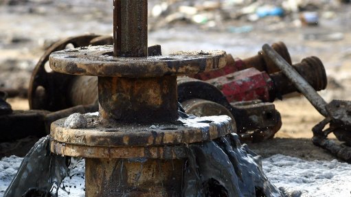 Crude oil pours from well