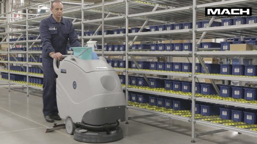 Image of a person using a MACH floor cleaning machine