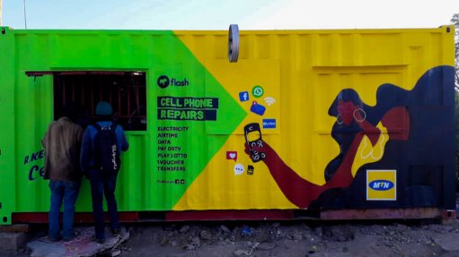 A spaza shop with Flash branding