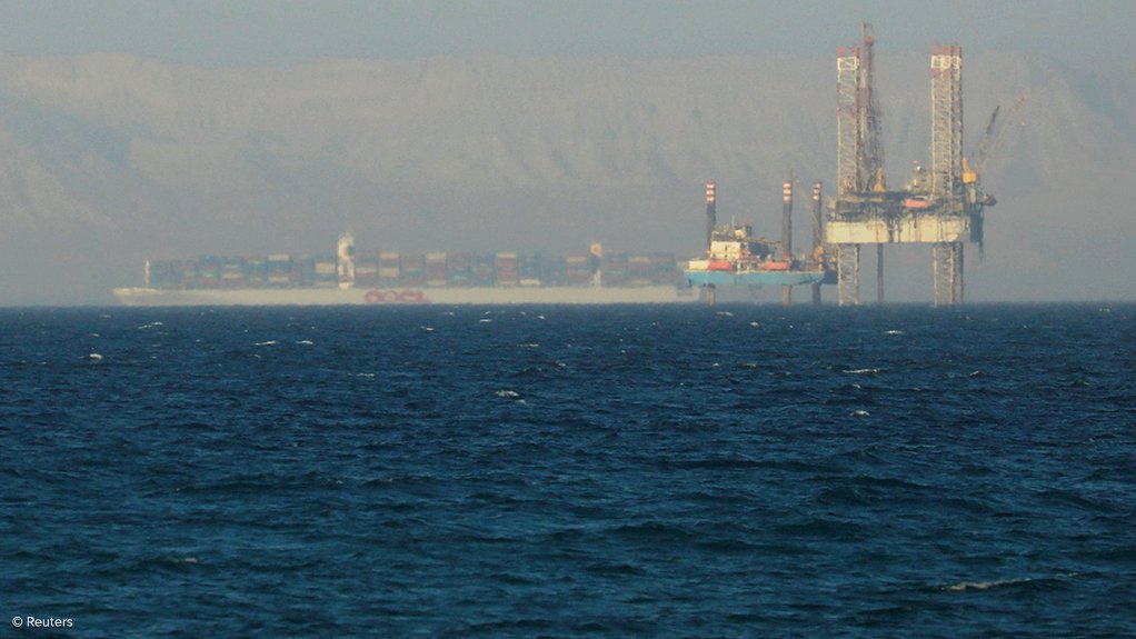 A container ship and oil rig near the Suez Canal