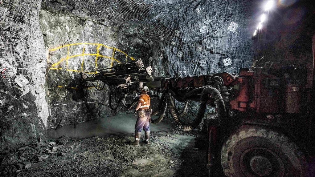 The above image depicts two blasting technicians mapping out a blasting design