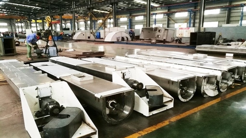 split cylindrical hanger units for screw conveyor shafts lined up and ready for installation