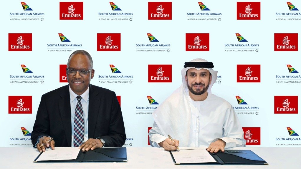 SAA acting group CEO Matshela Seshibe and Emirates chief commercial officer Adnan Kazim signing the codeshare agreement
