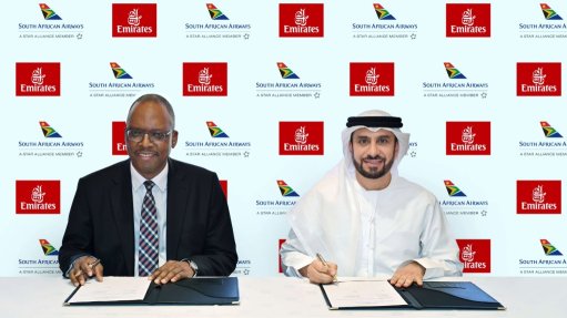 SAA acting group CEO Matshela Seshibe and Emirates chief commercial officer Adnan Kazim signing the codeshare agreement