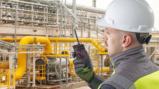 Worker in factory using the IS541.1 mobile phone