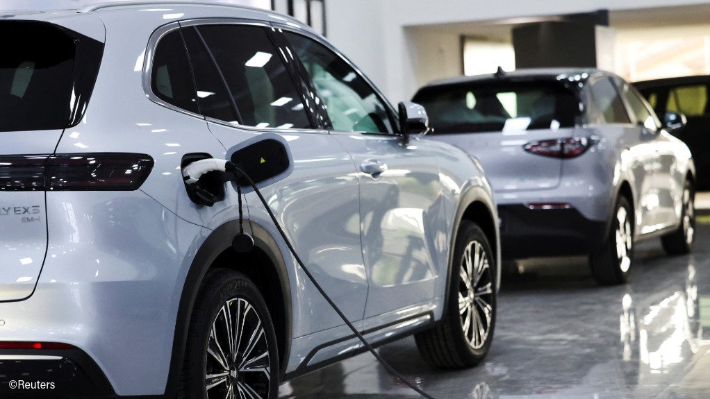 A Geely EV being charged at a showroom