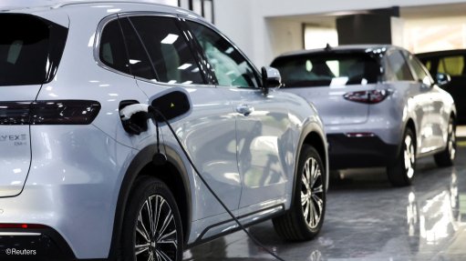 A Geely EV being charged at a showroom