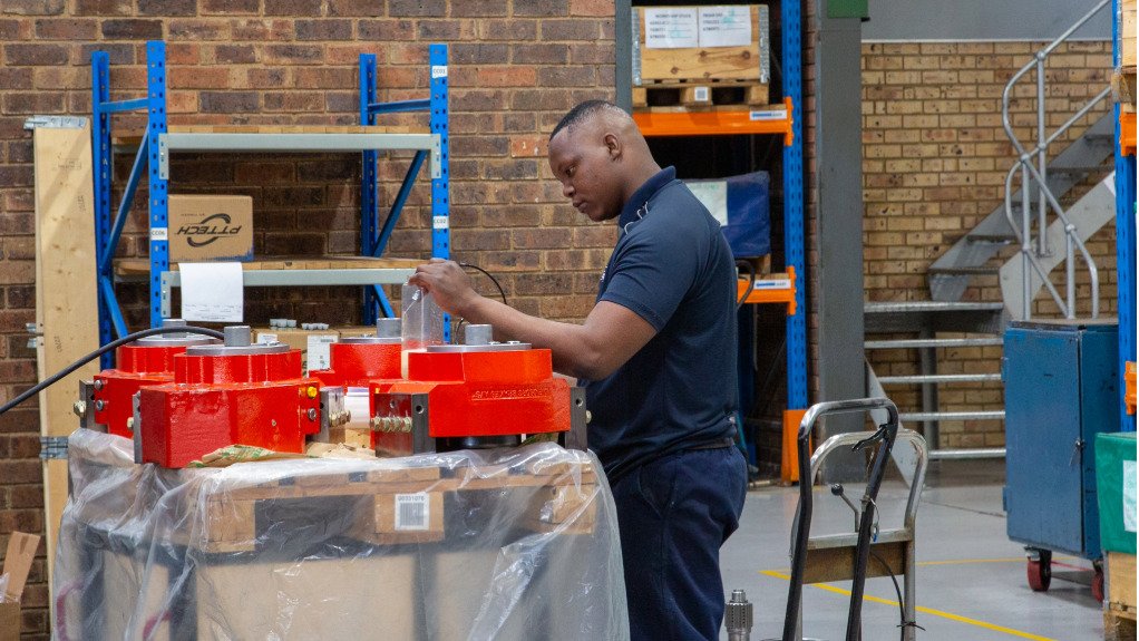 a man stood in a workshop