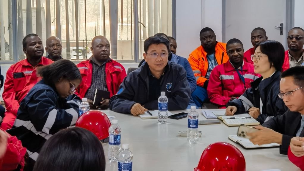 Conference room with local and international staff from China Mineral Resources Group
