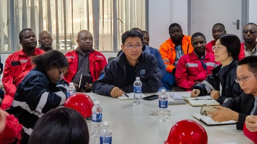 Conference room with local and international staff from China Mineral Resources Group