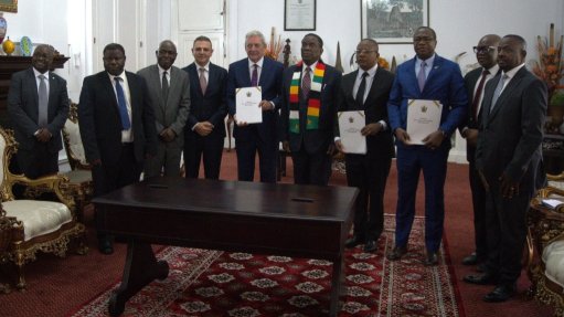 Executives from Tharisa and Karo Platinum and representatives of the Zimbabwe government, including President Emmerson Mnangagwe, at the signing of a 25-year mining lease