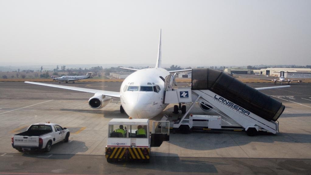 An image of an aeroplane with stair bridge