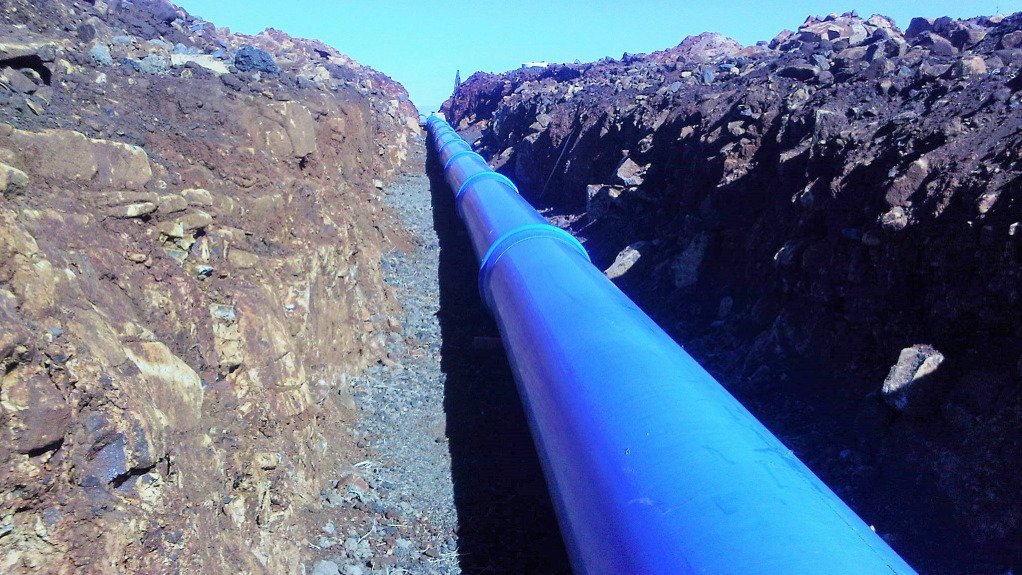 An image of a PVC pipe in a ground canal