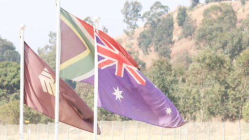 West Wits Mining's flag, alongside the South African flag and the Australian flag at the Witwatersrand Basin Project