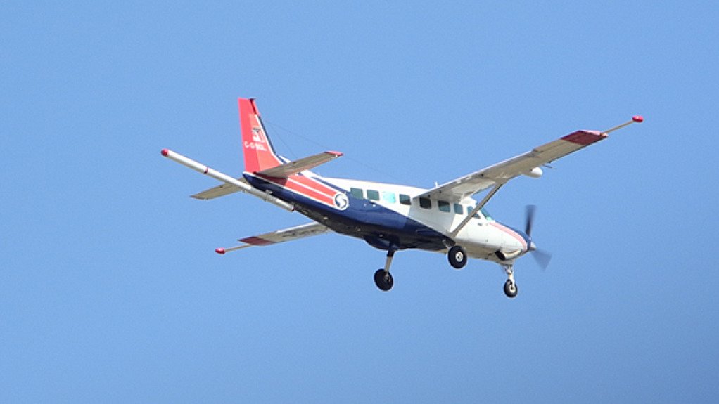 The above image depicts a plane in the process of an aeromagnetic survey