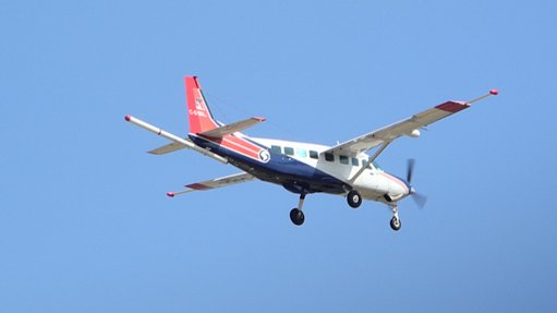 The above image depicts a plane in the process of an aeromagnetic survey
