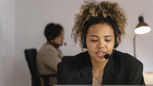 Person wearing a telephone headset