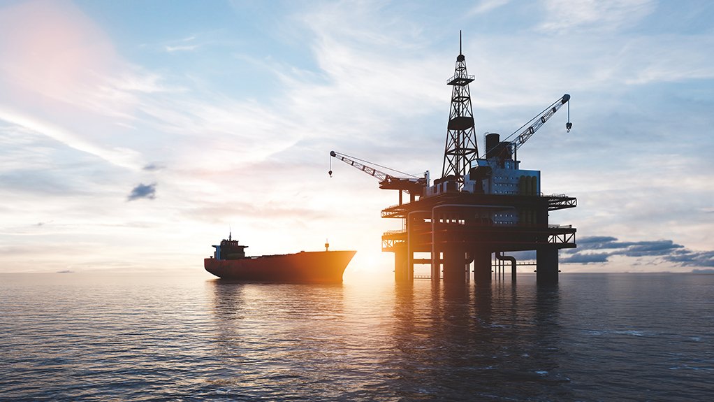 An oil tanker at sea near an offshore oil rig