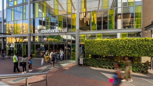 Shoppers at an entrance to the Rosebank Mall