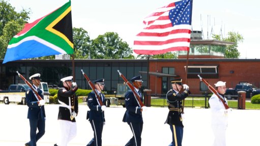 South Africa and US flags with marchers