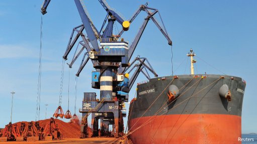 Bauxite being loaded onto a ship in Guinea